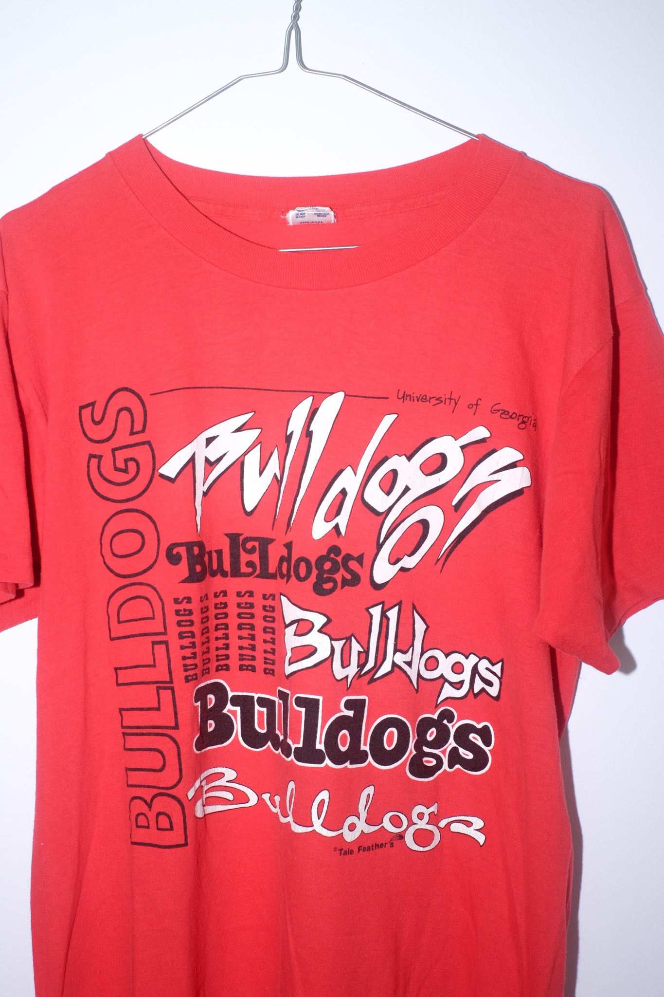 Red t-shirt with 'Bulldogs' text on a white background